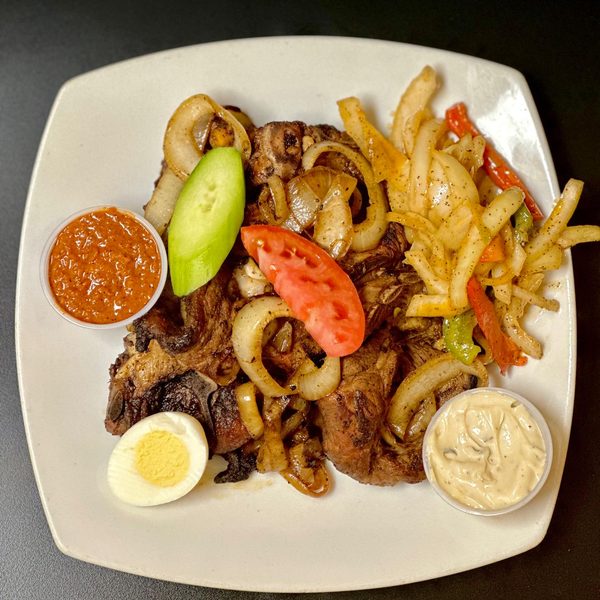 Dibi lamb off the grill with onions and sauces